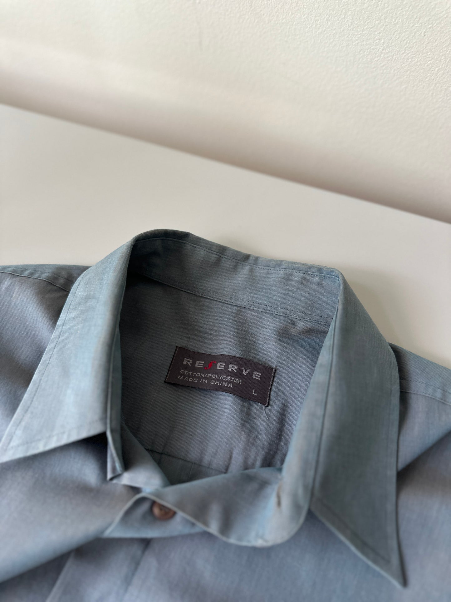 blue opaque button up