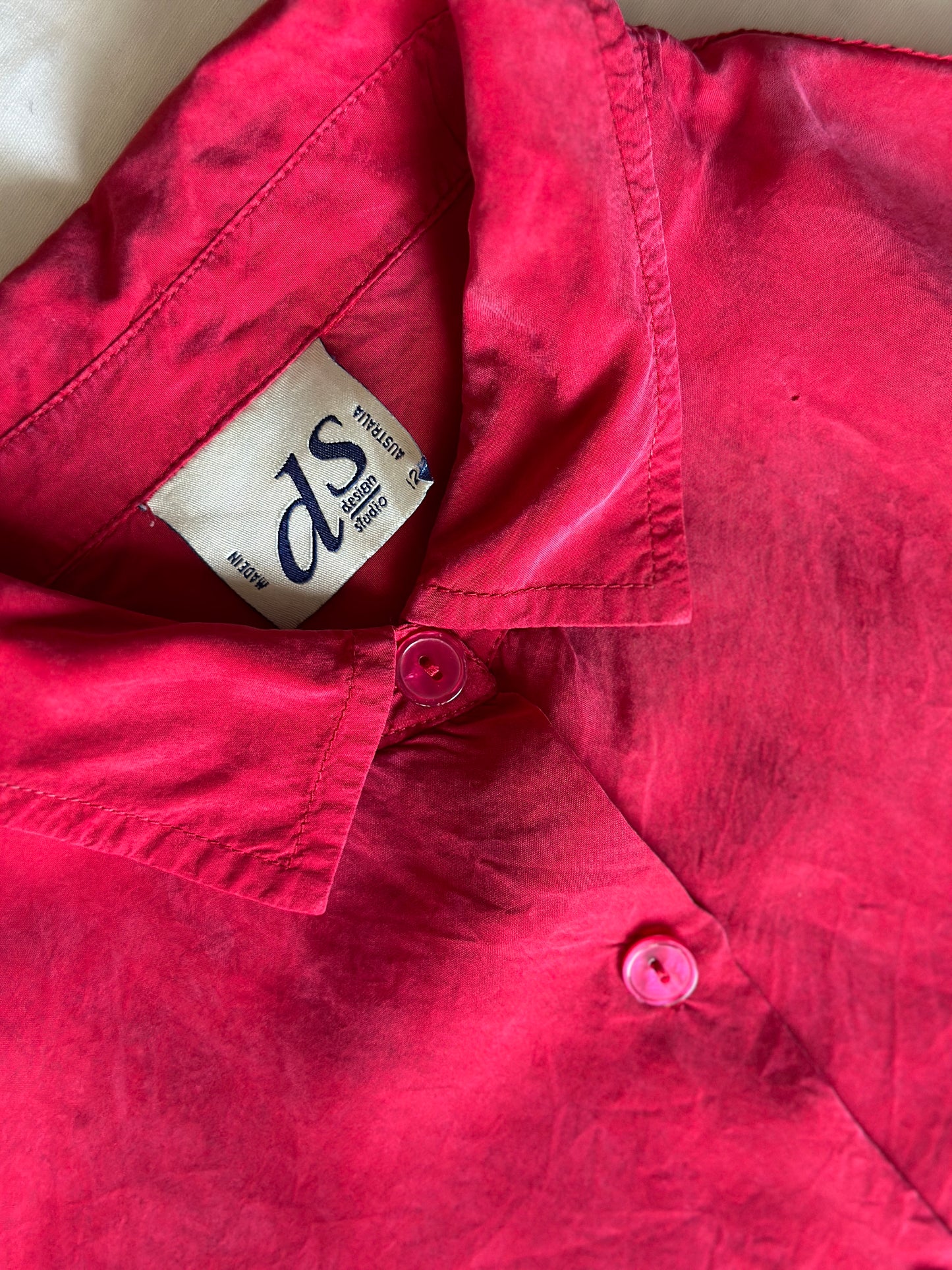vibrant red silk shirt