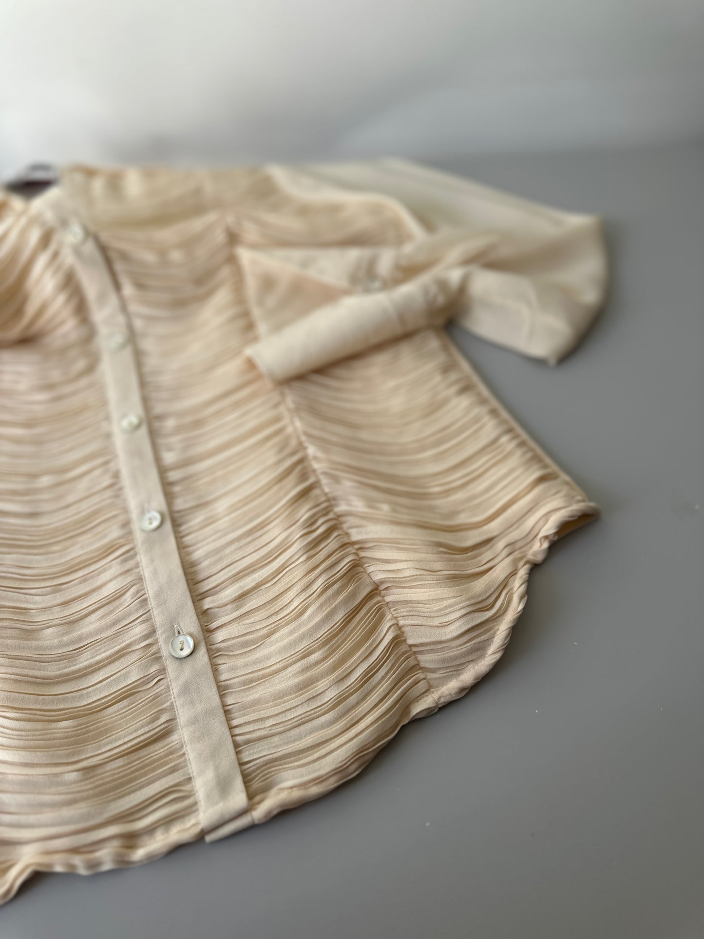 cream ruffled blouse