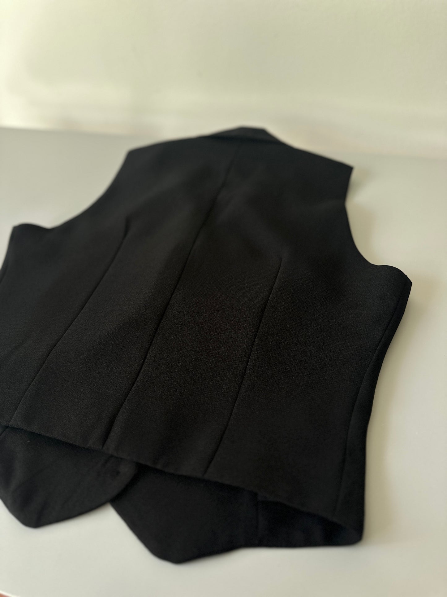 black button-up vest