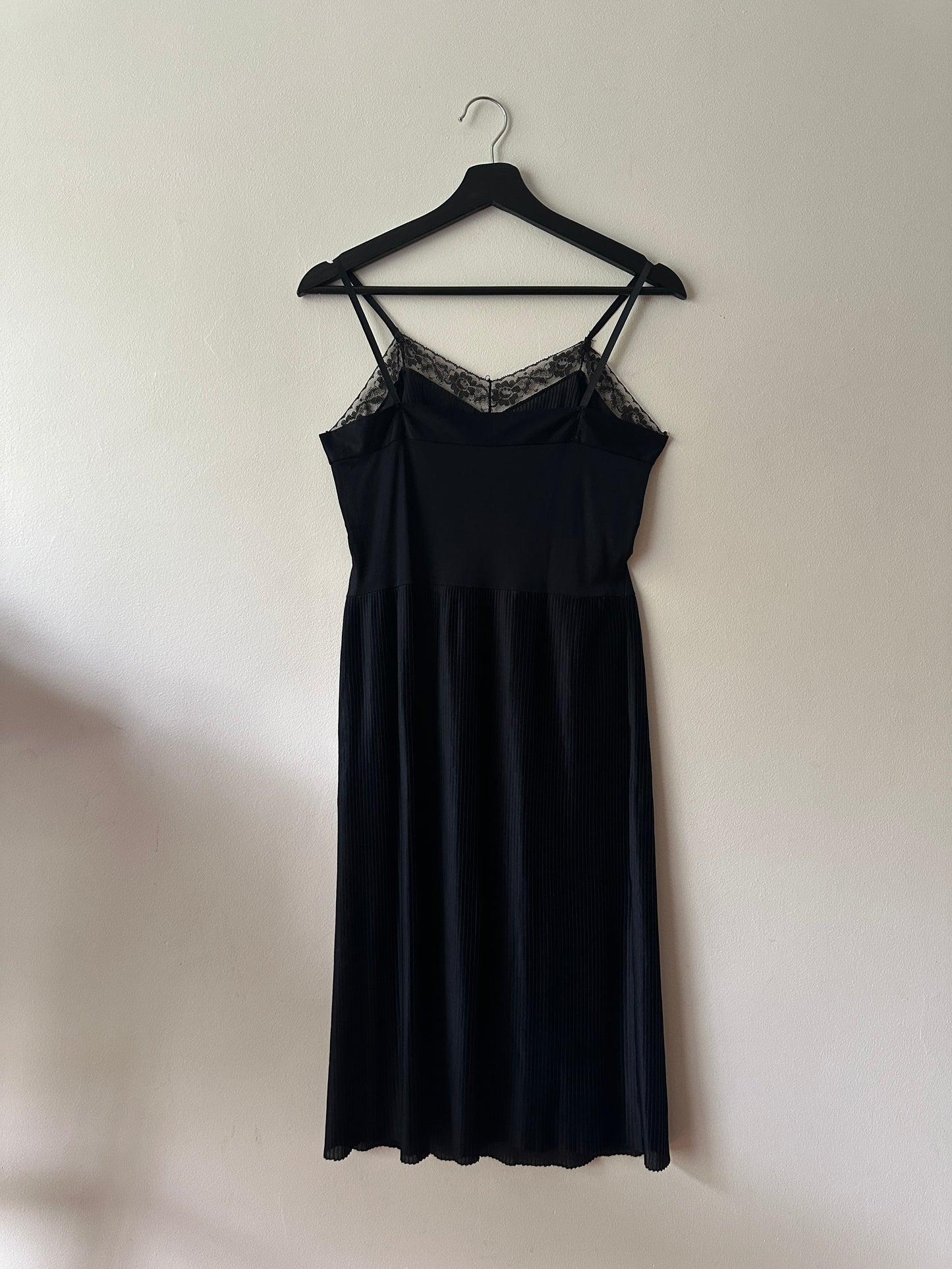 black pleated mid-length slip