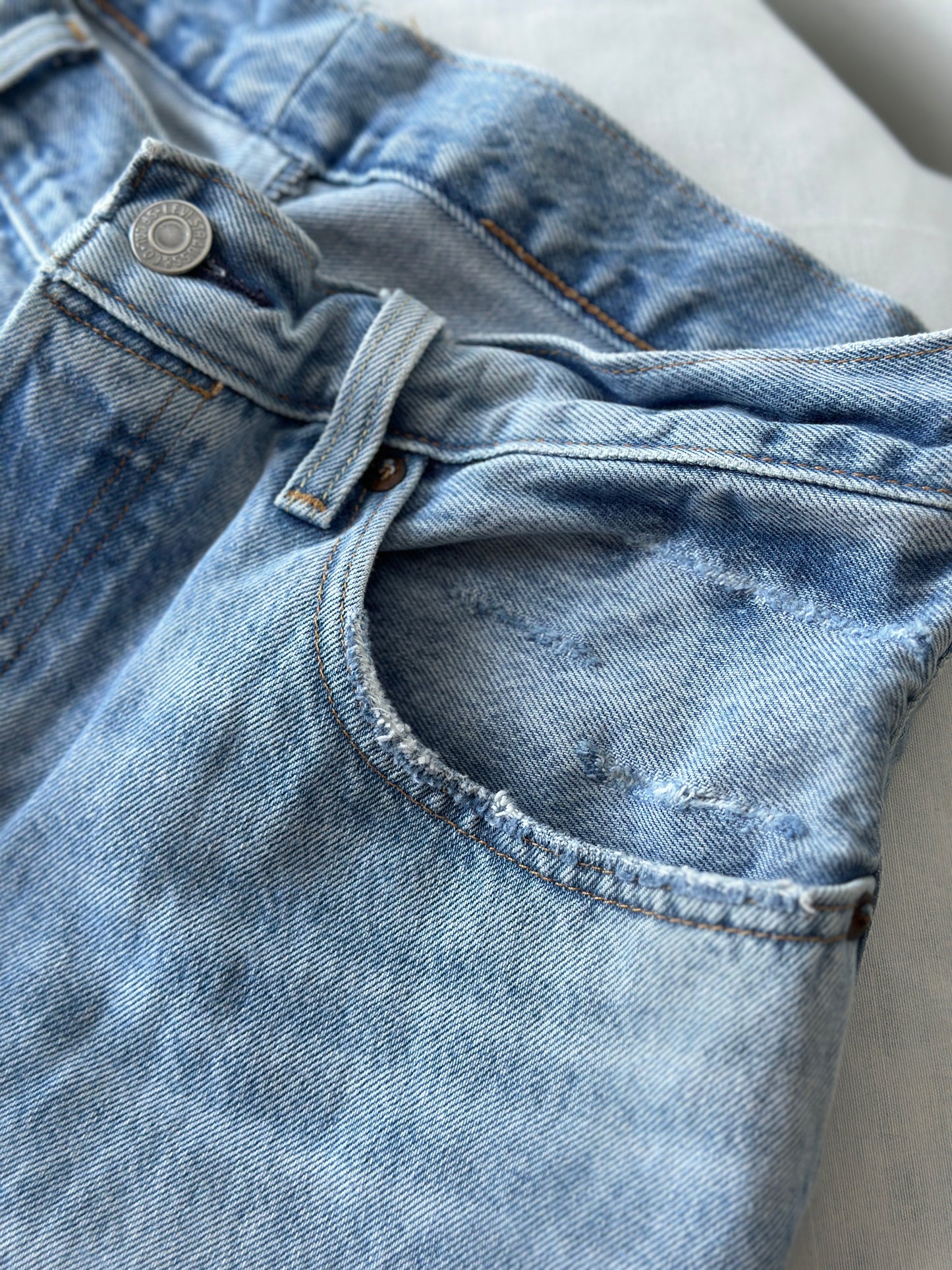 Levi ripped light blue jeans