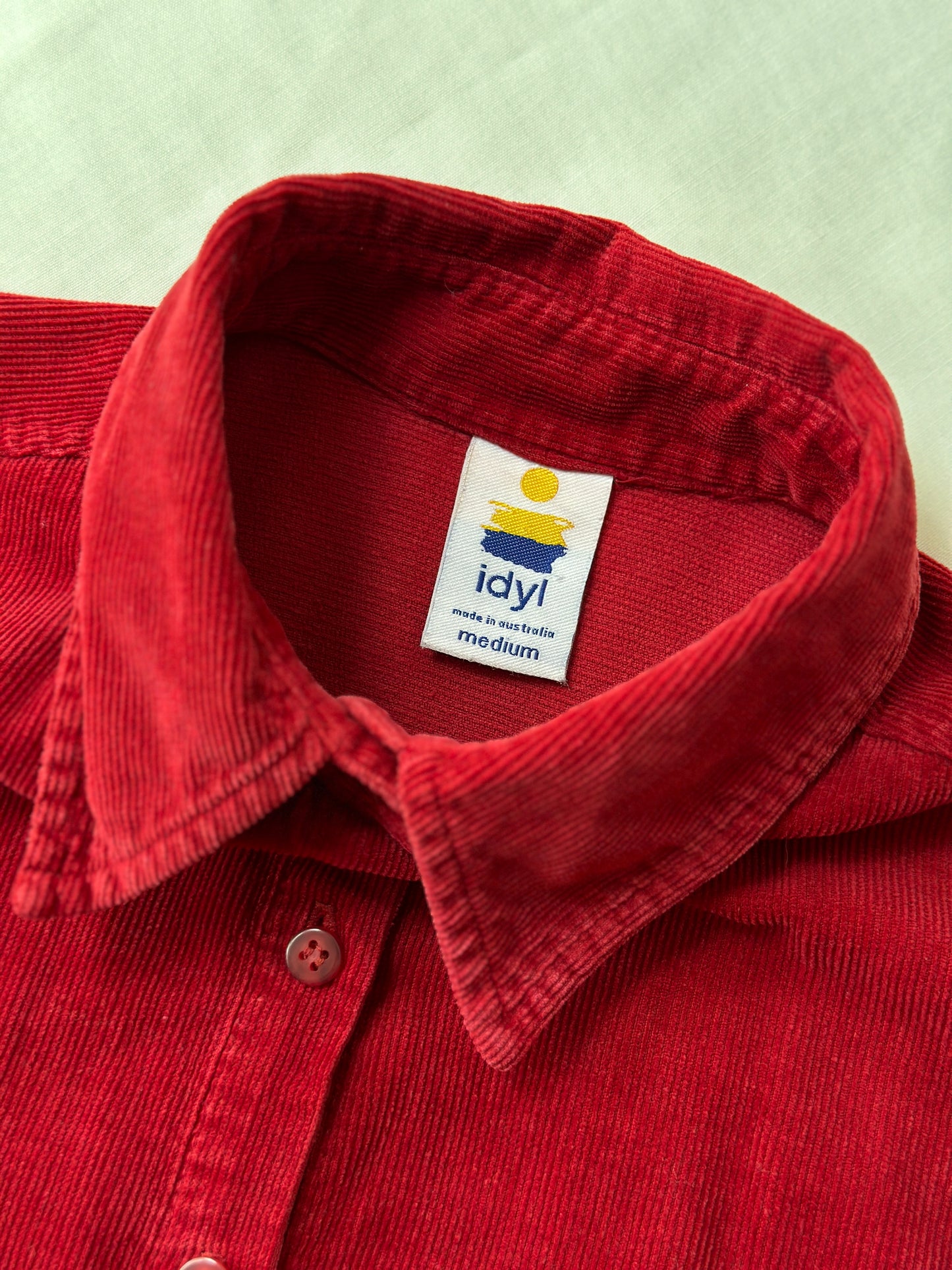 red corduroy button up