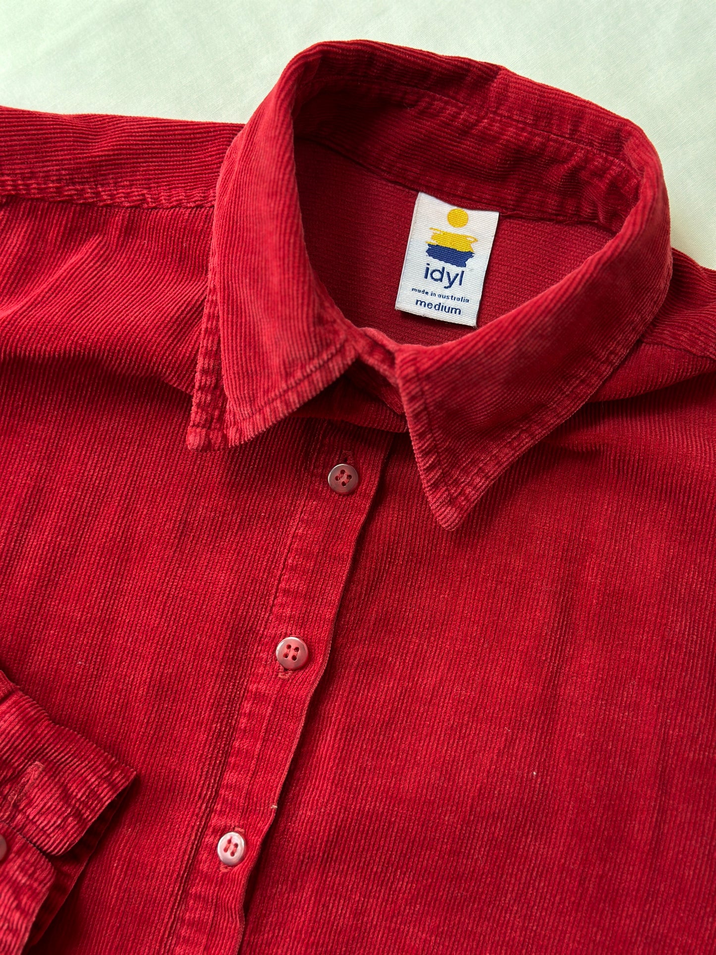 red corduroy button up