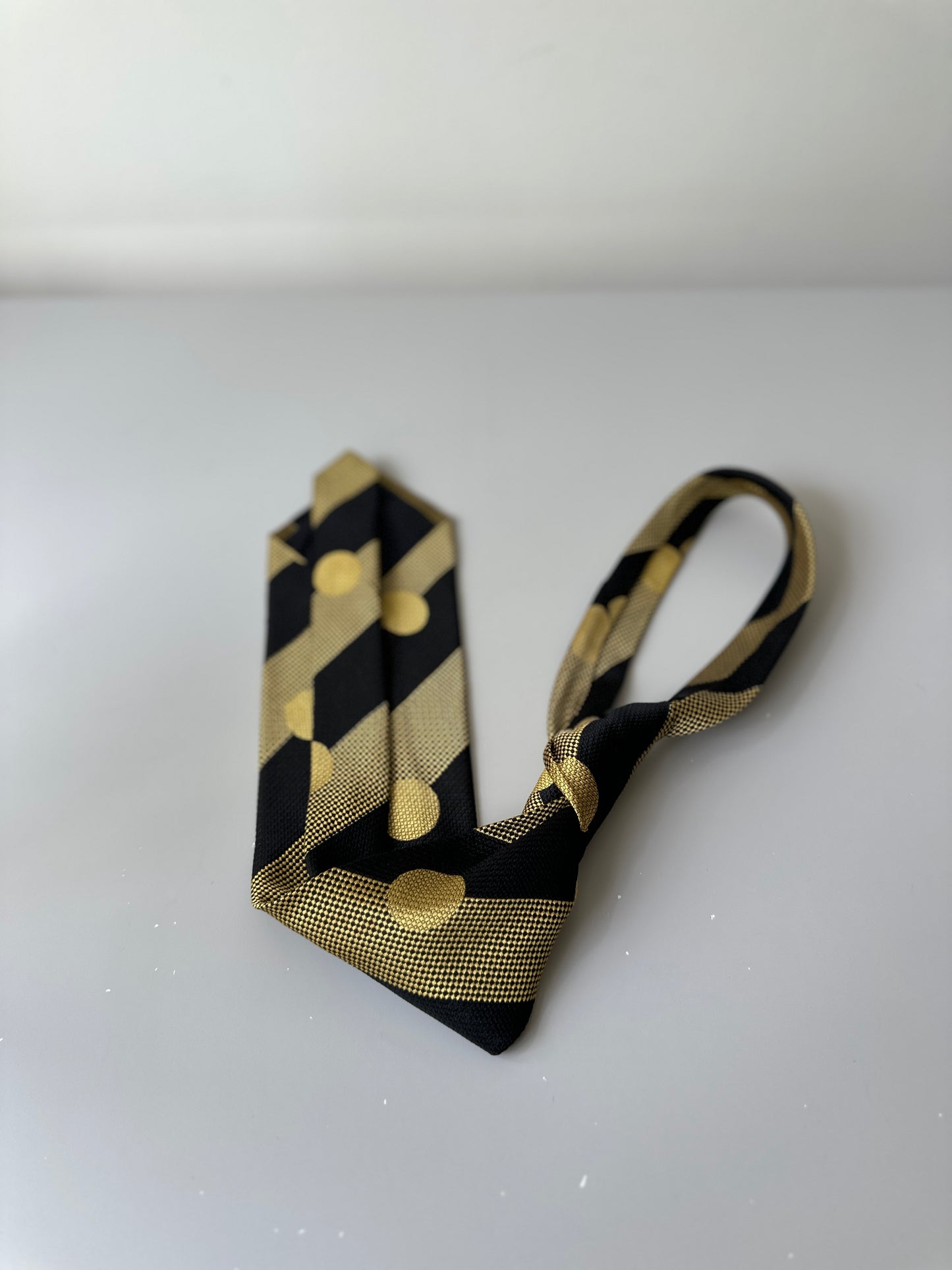 yellow/black polka dot tie