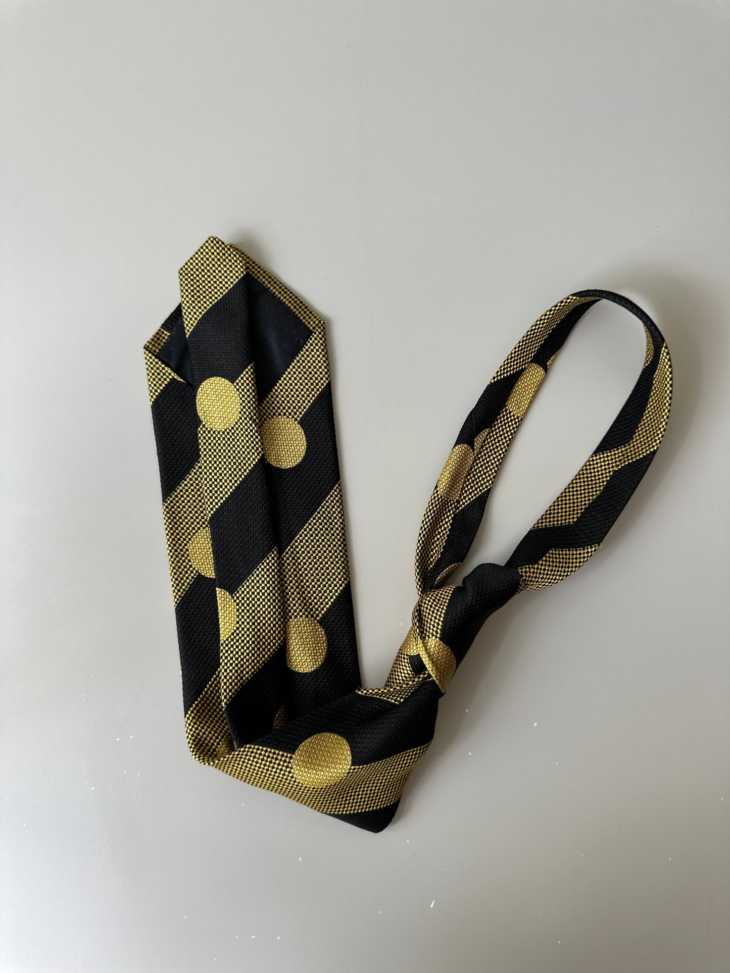 yellow/black polka dot tie