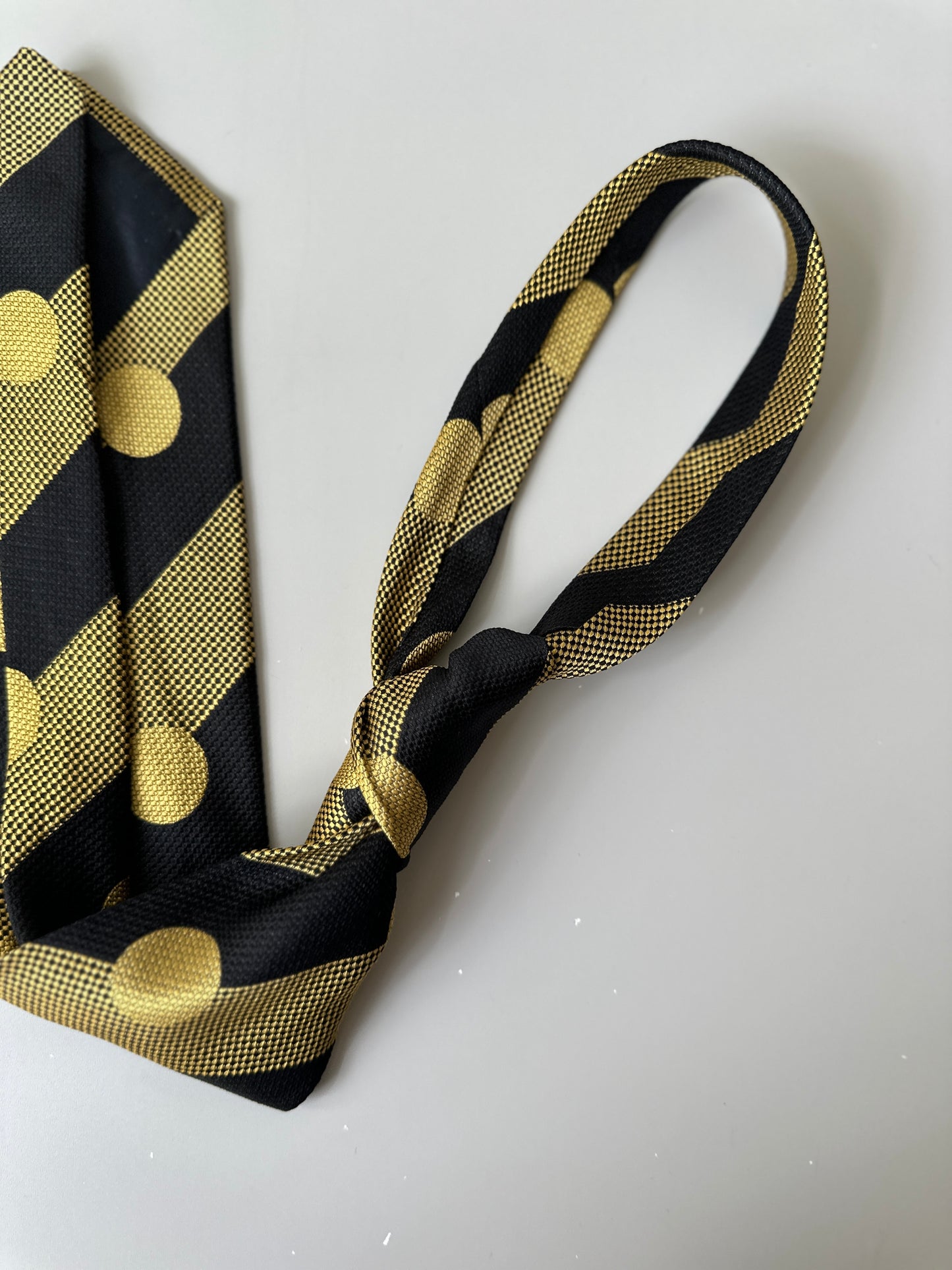 yellow/black polka dot tie