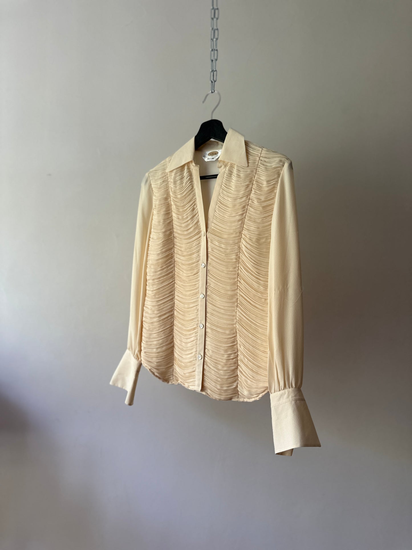 cream ruffled blouse