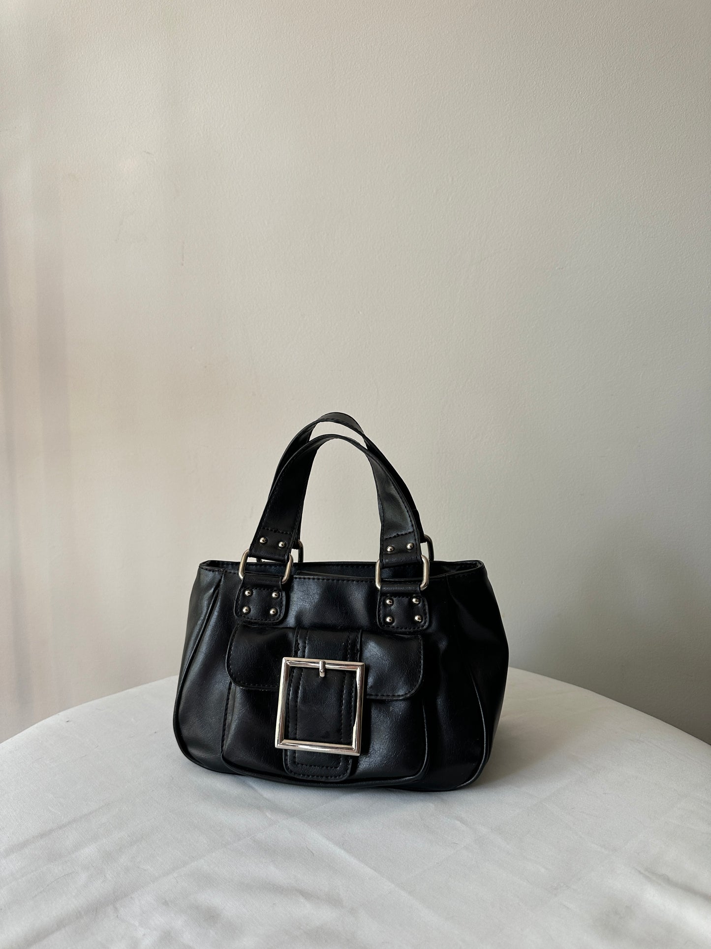 black buckle handbag