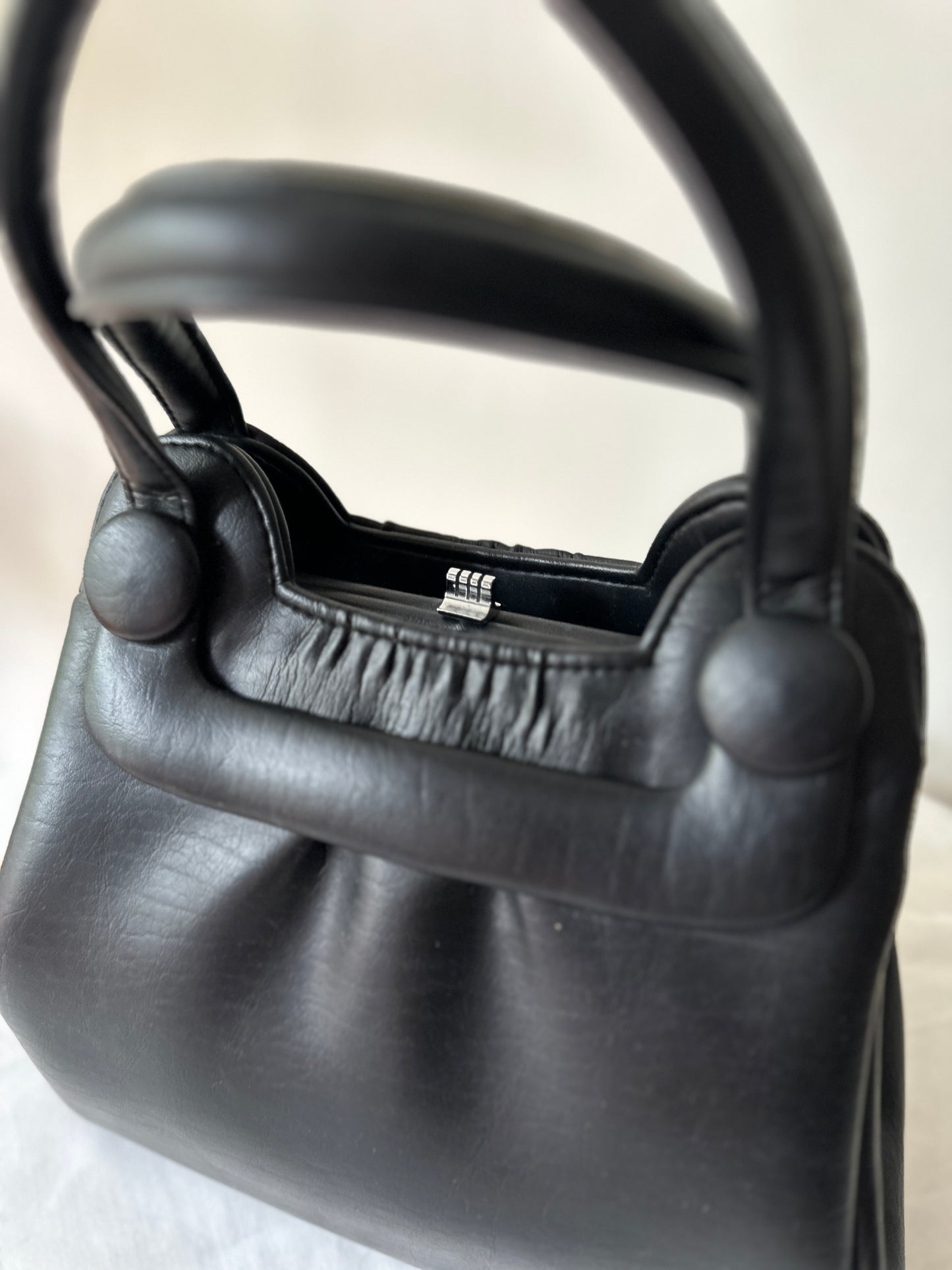 black vinyl handbag