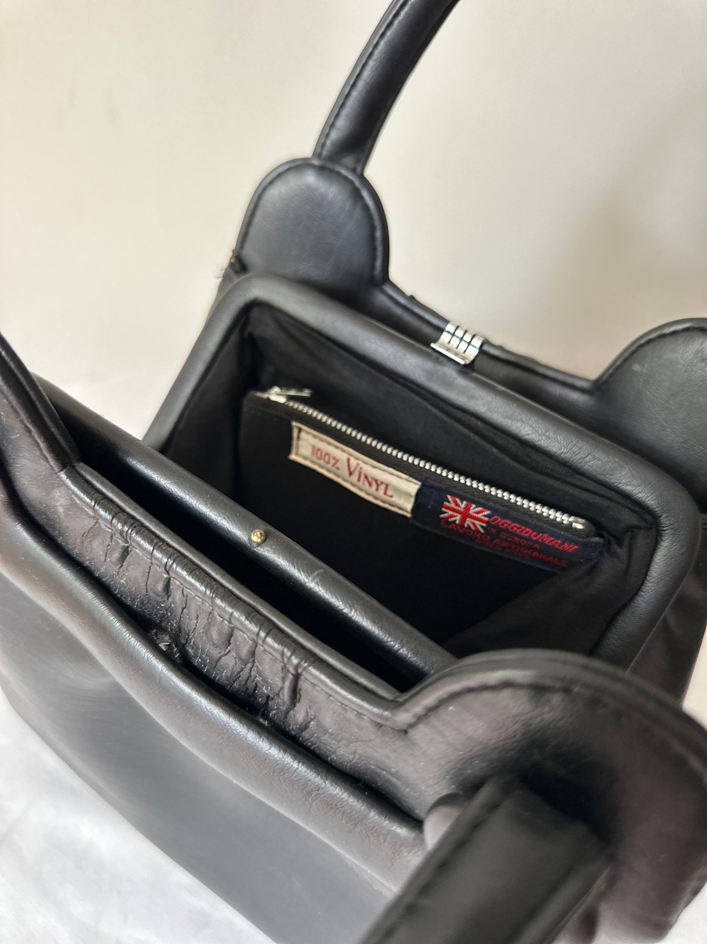 black vinyl handbag
