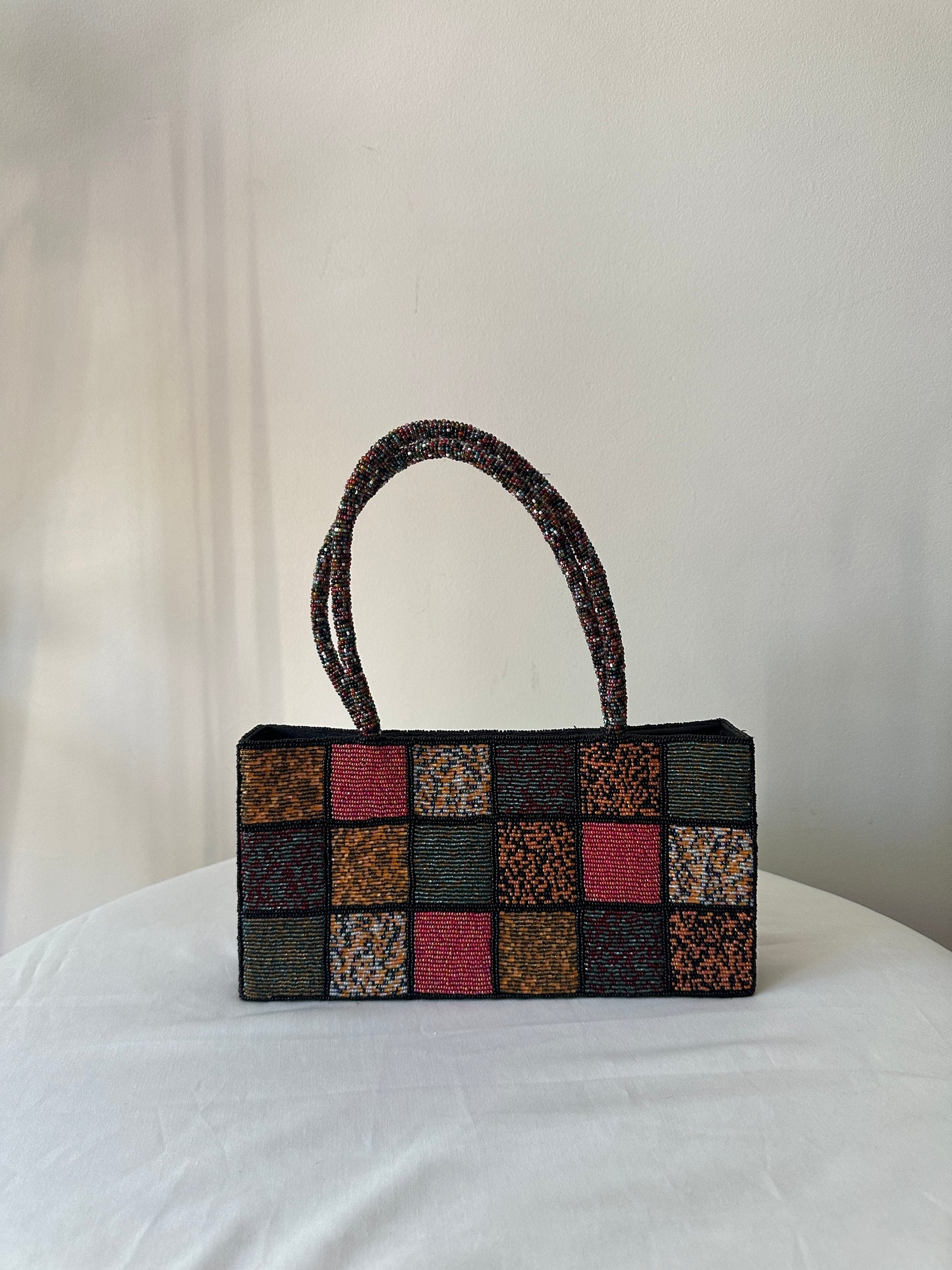 checkered beaded handbag