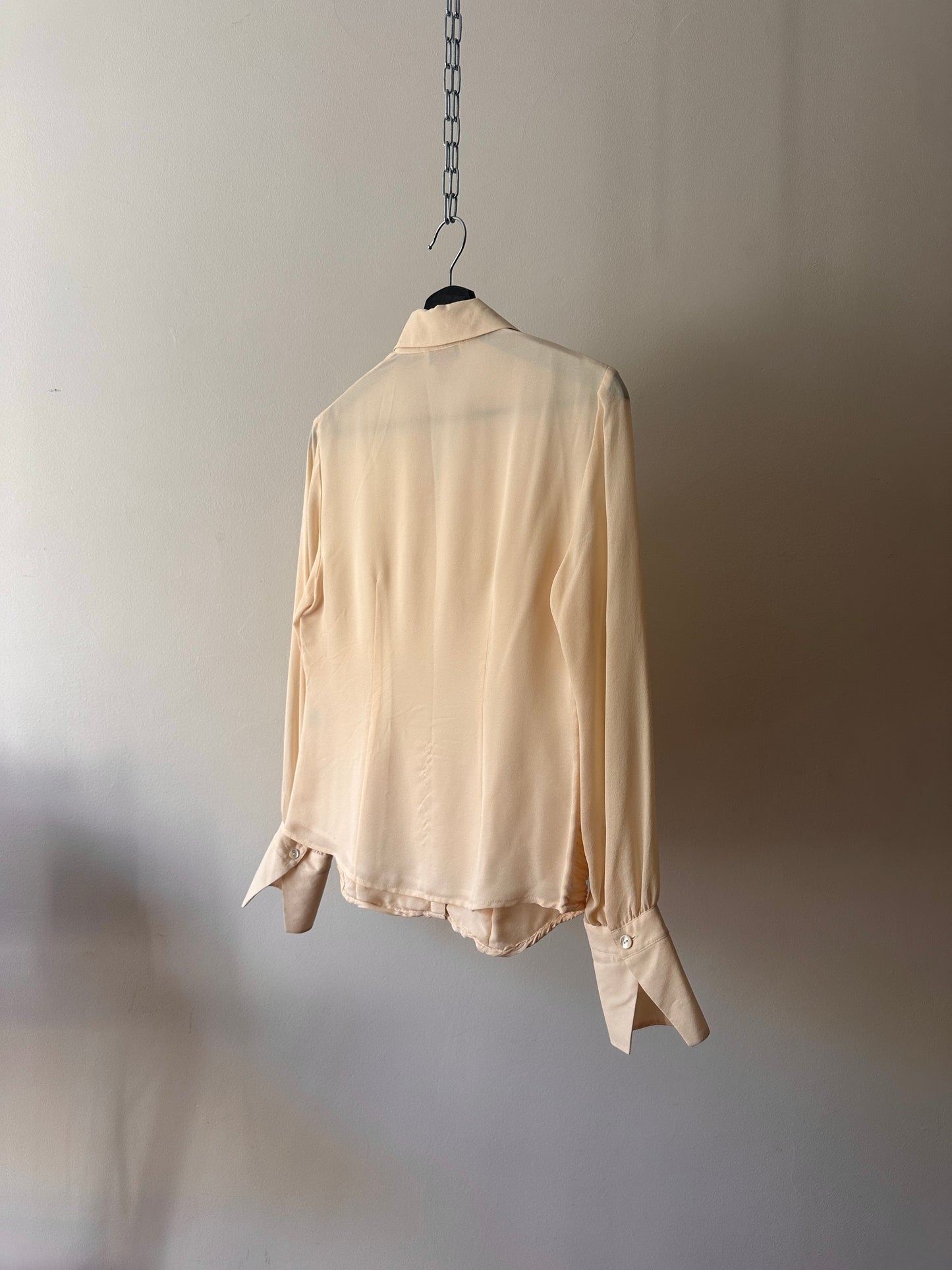 cream ruffled blouse