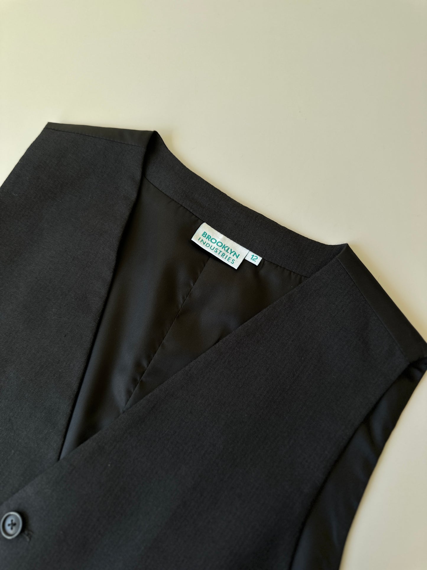 black button up vest