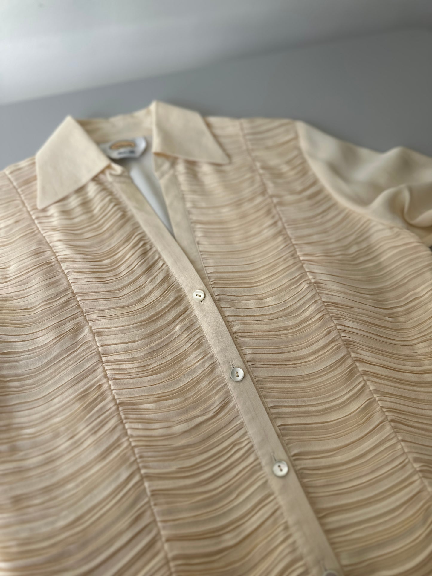cream ruffled blouse