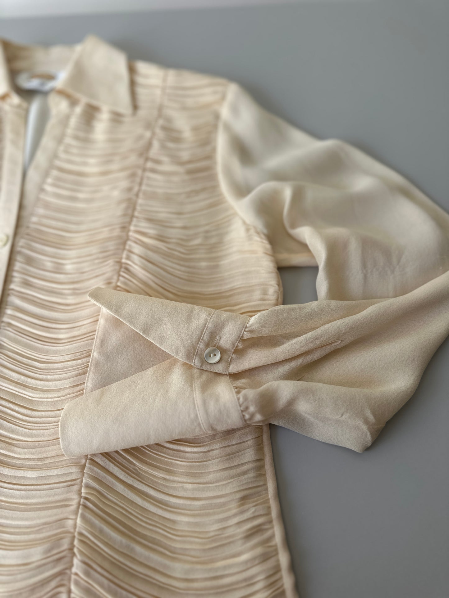 cream ruffled blouse