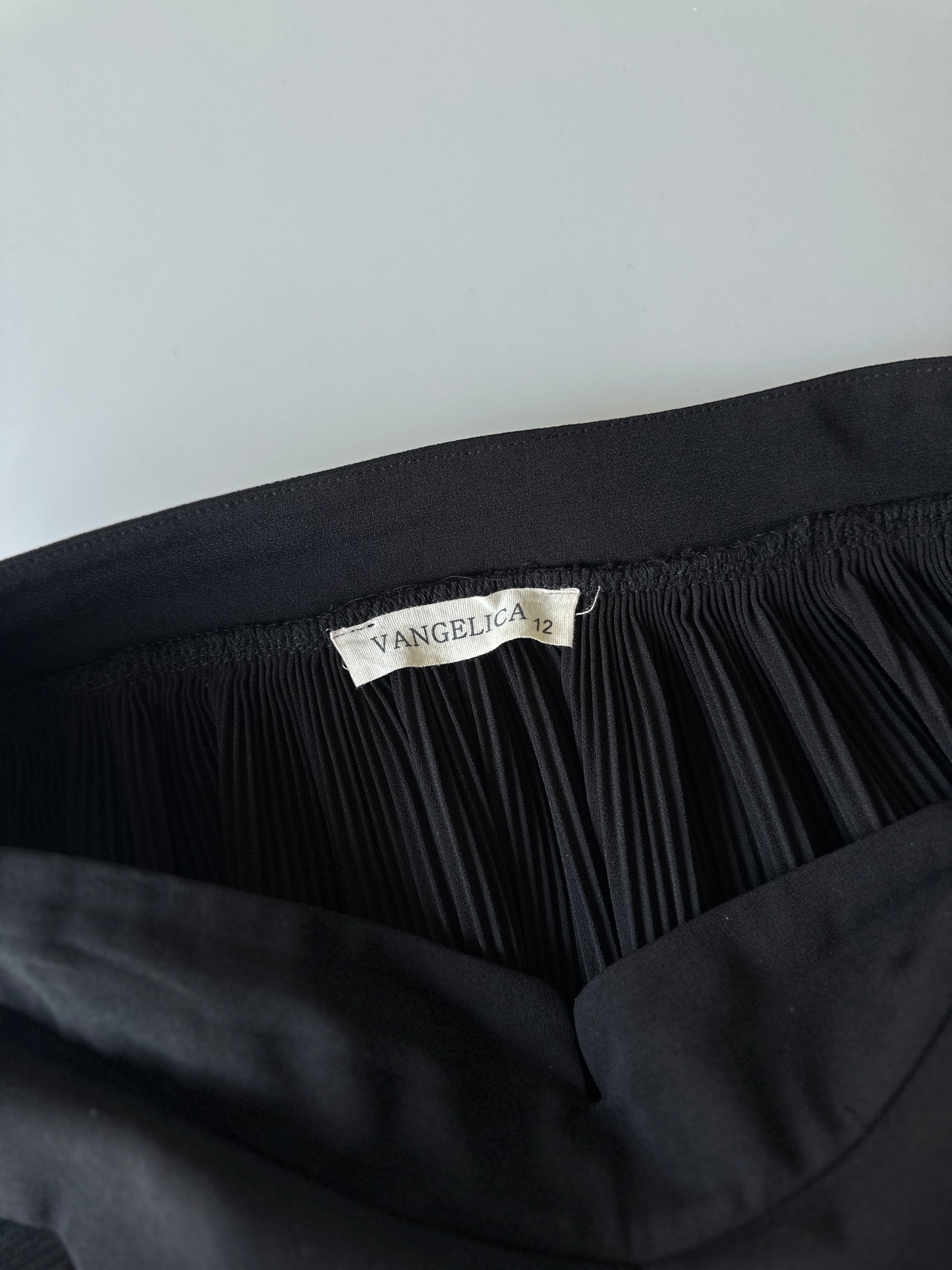 black pleated midi skirt