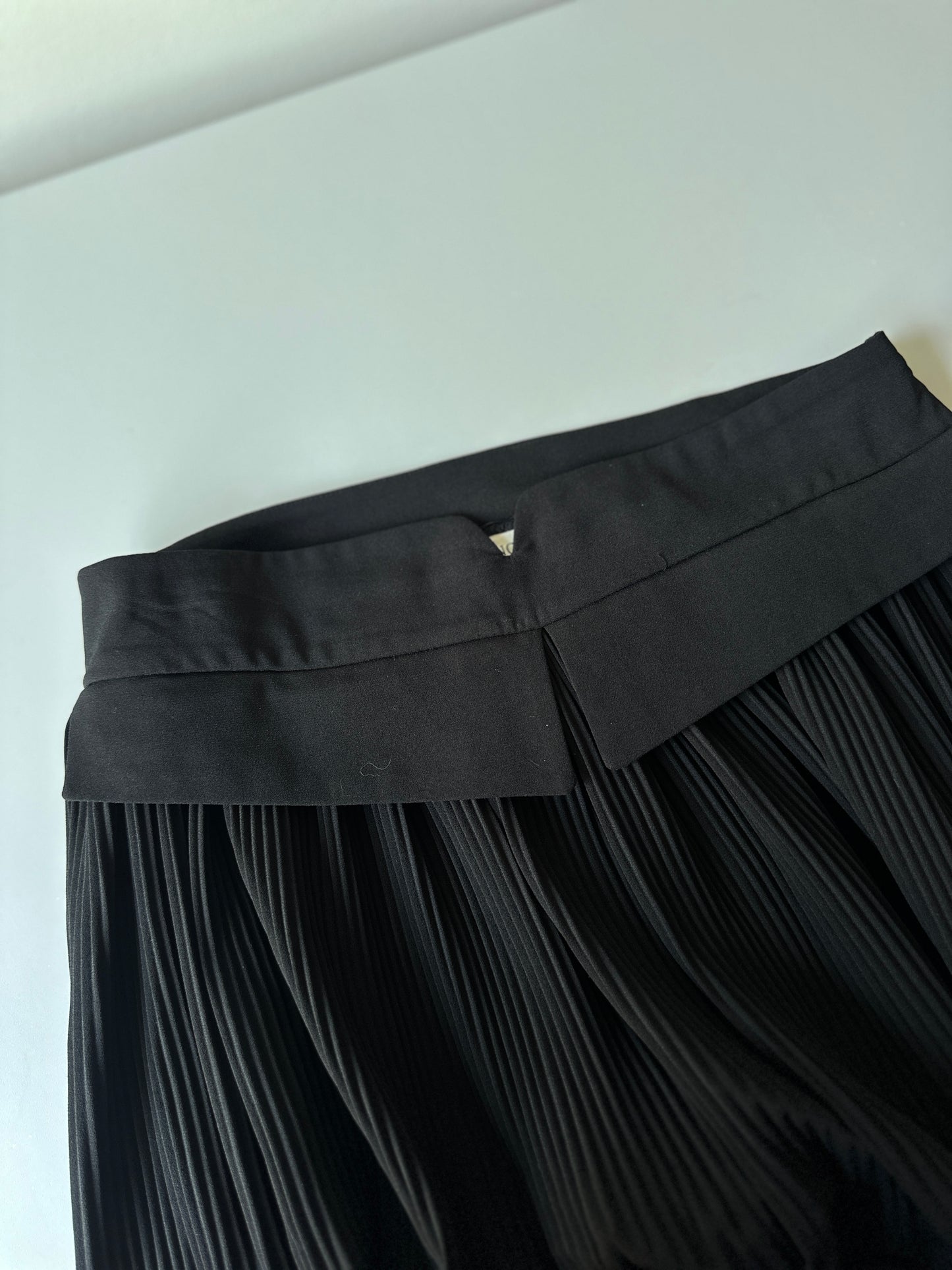 black pleated midi skirt