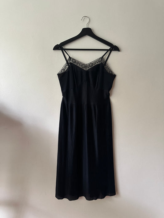 black pleated mid-length slip