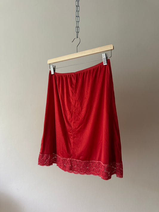 red dyed short slip skirt