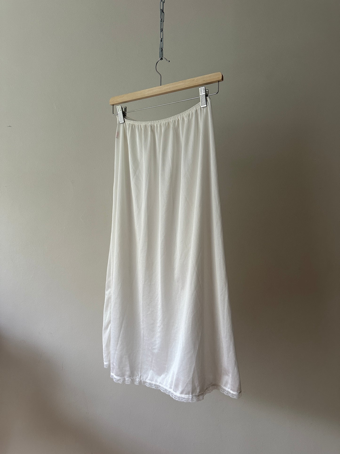 white mid-length slip skirt