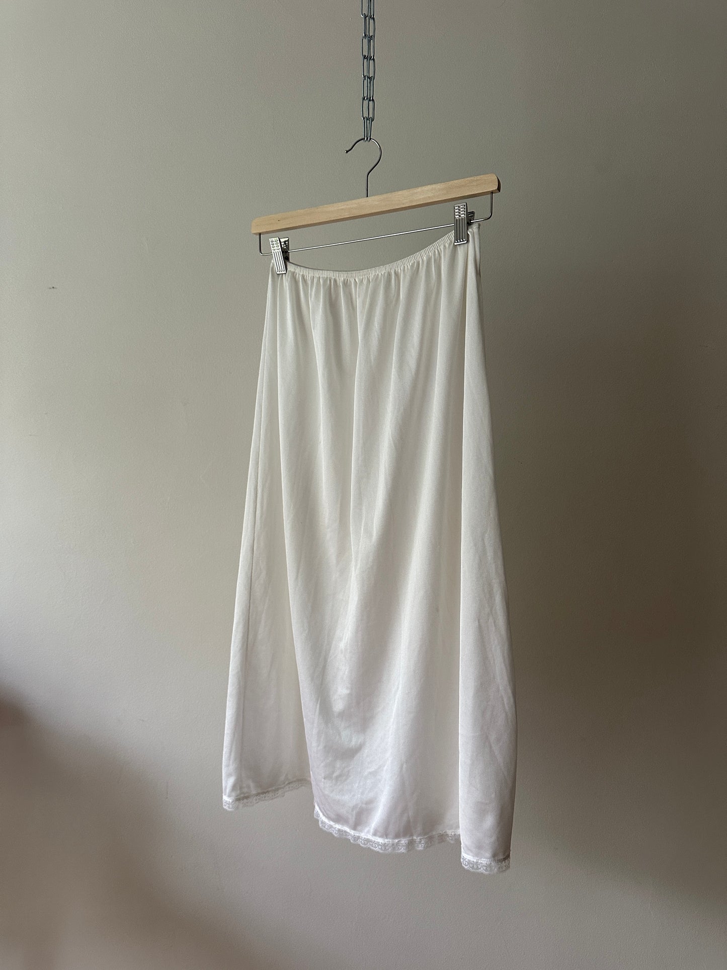 white mid-length slip skirt