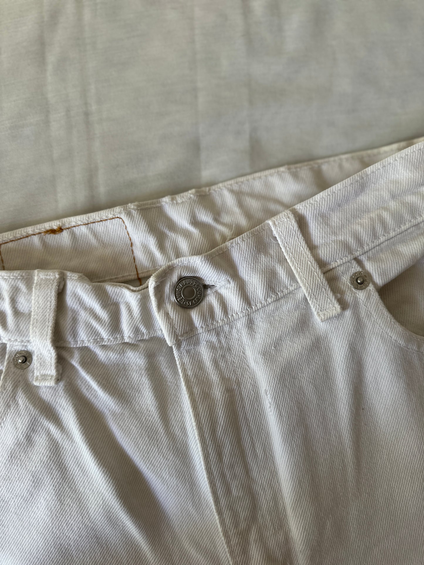 white Levi jeans