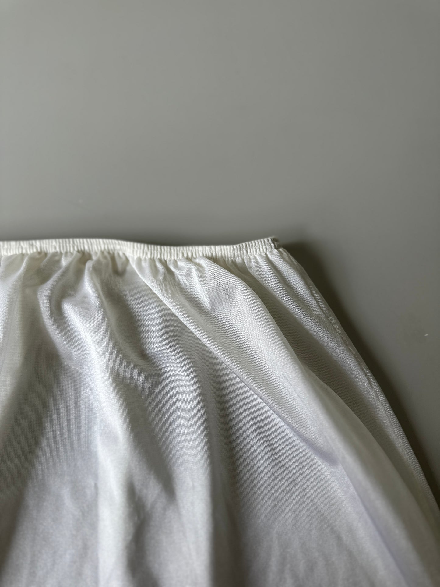 white mid-length slip skirt