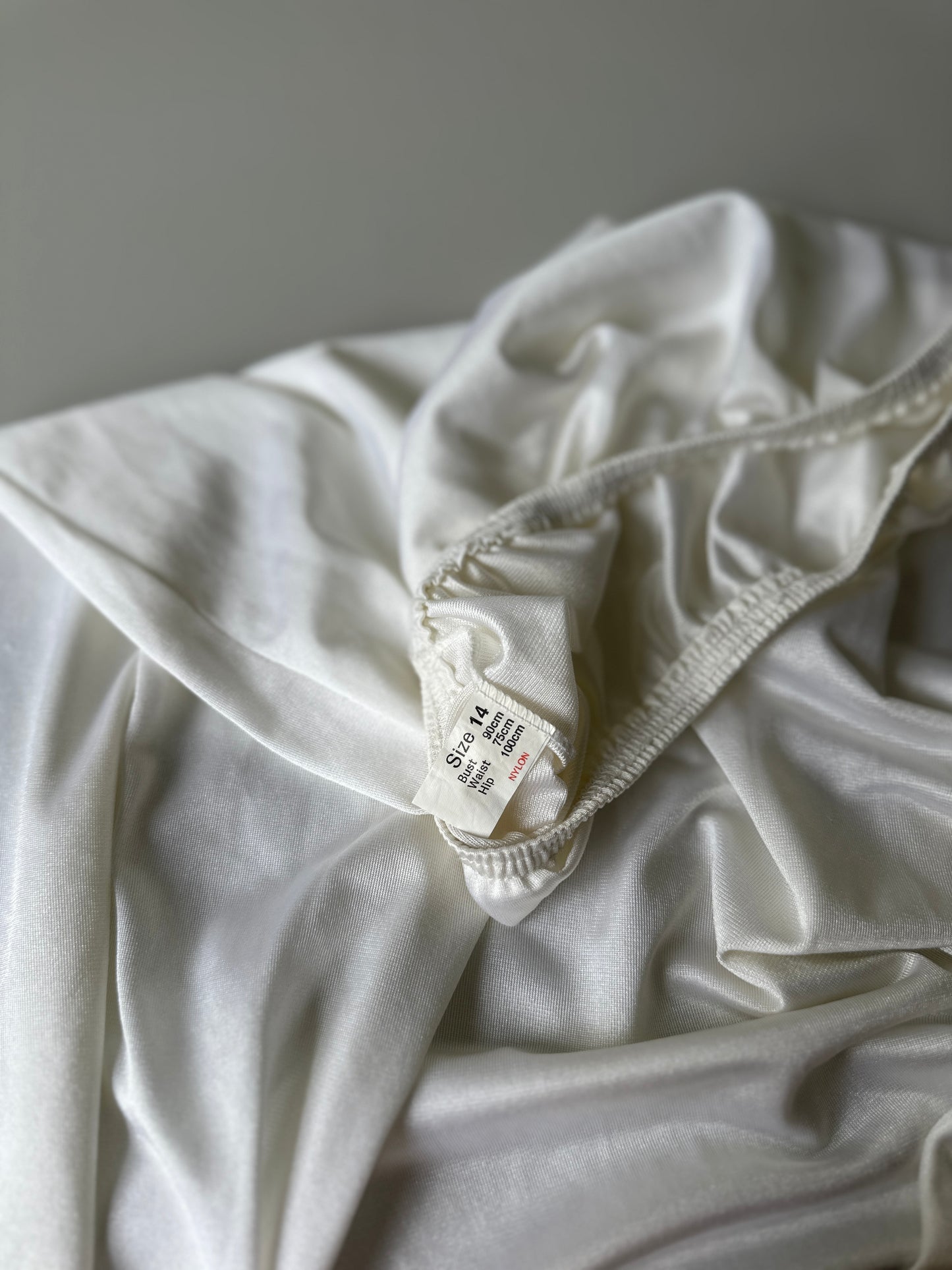 white mid-length slip skirt