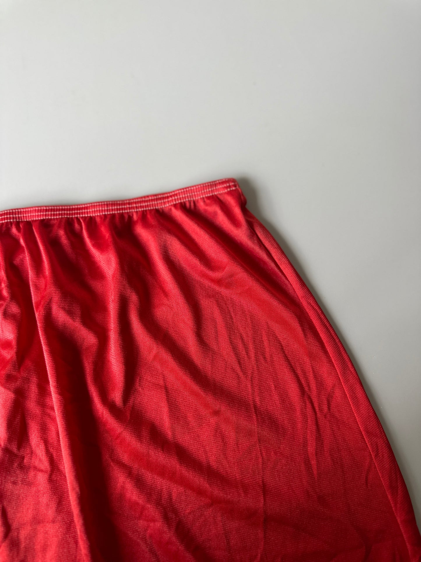 red dyed short slip skirt
