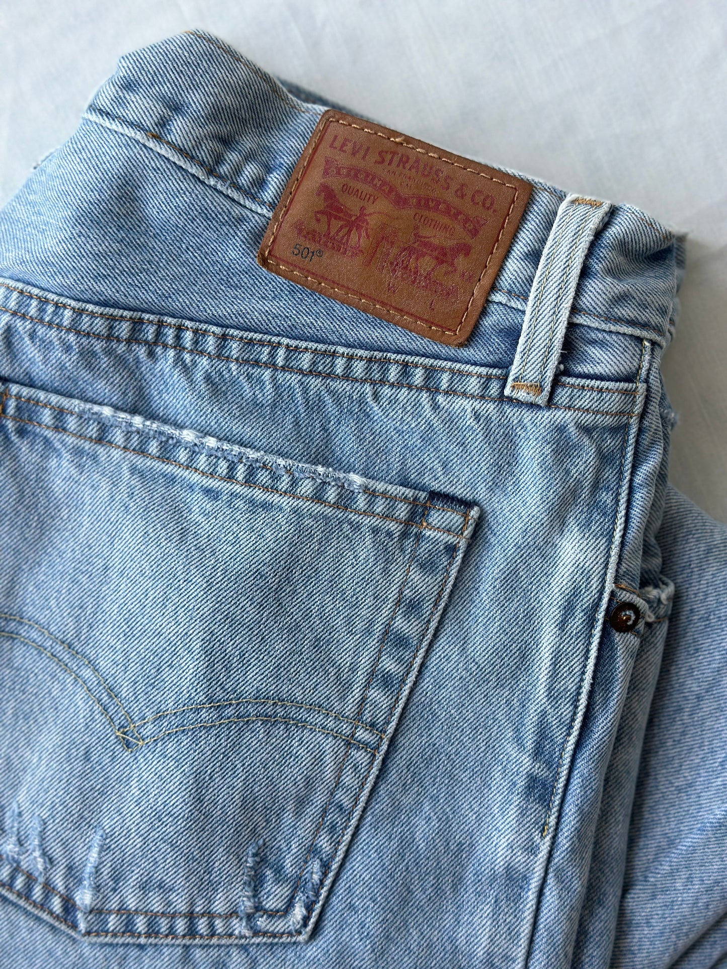 Levi ripped light blue jeans
