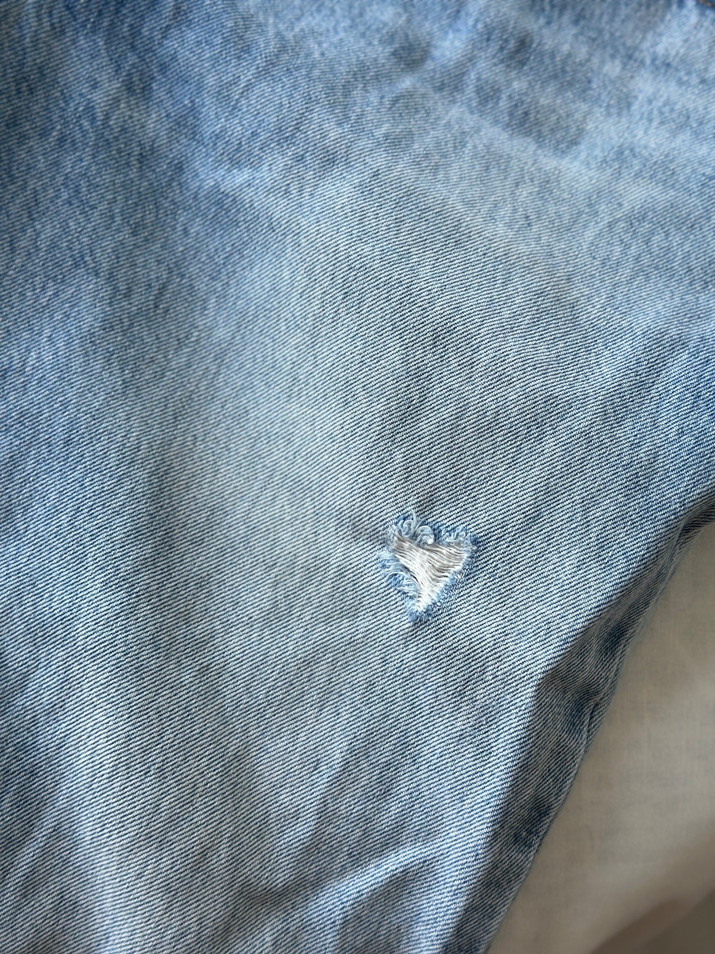 Levi ripped light blue jeans