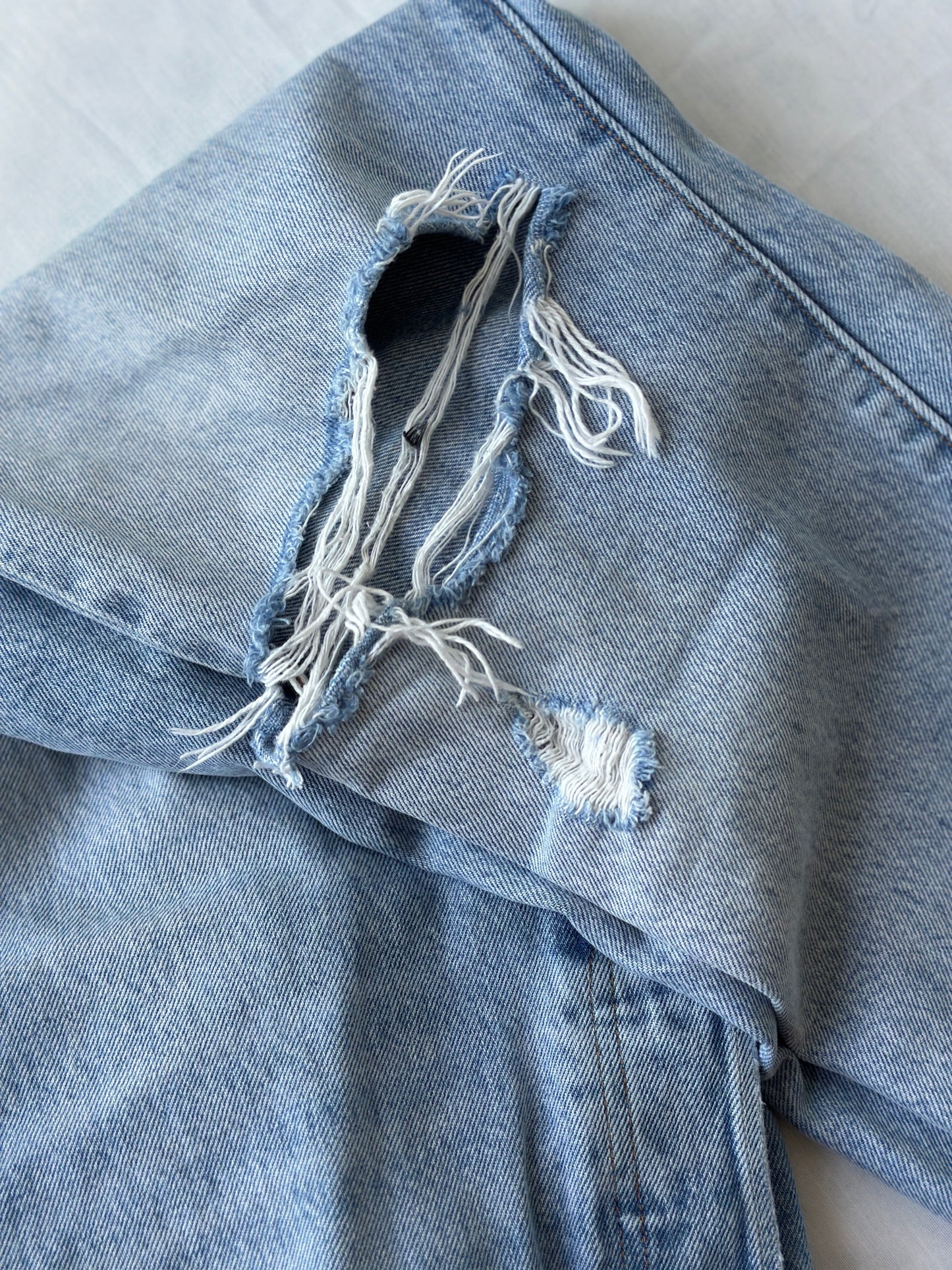 Levi ripped light blue jeans