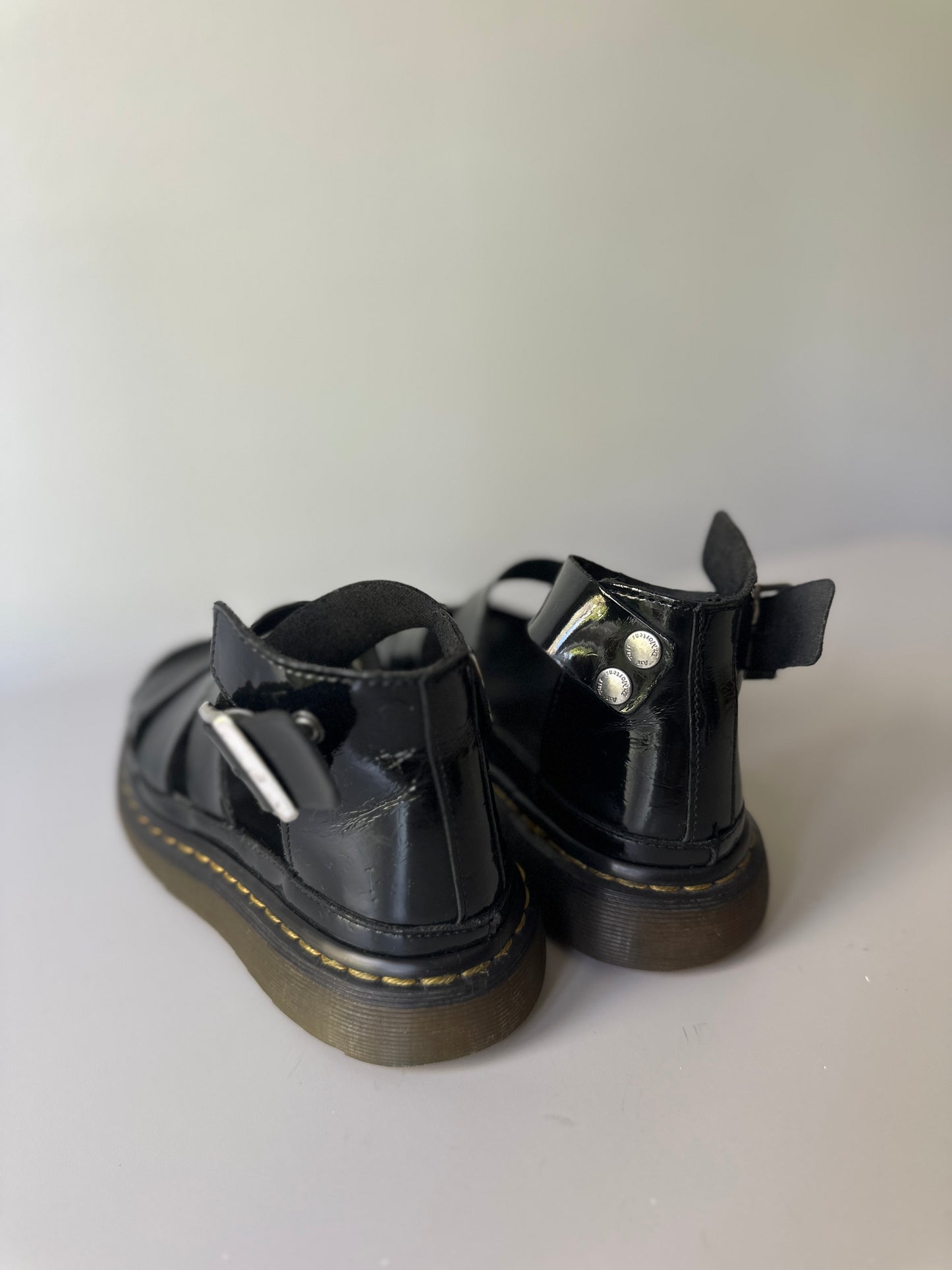 black patent Dr. Marten three strap sandals
